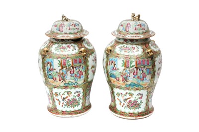 Lot 534 - A PAIR OF CHINESE CANTON FAMILLE-ROSE BALUSTER VASES AND COVERS