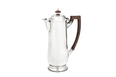 Lot 333 - A George V 'Arts and Crafts' sterling silver hot water or coffee pot, London 1915 by Charles John Plucknett (reg. 15th Dec 1915)