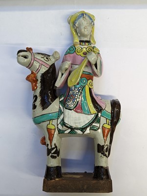 Lot 487 - A MATCHED PAIR OF CHINESE FAMILLE-ROSE 'LADY AND HORSE' FIGURES