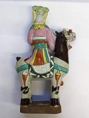 Lot 487 - A MATCHED PAIR OF CHINESE FAMILLE-ROSE 'LADY AND HORSE' FIGURES