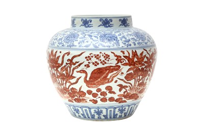 Lot 866 - A CHINESE COPPER RED-ENAMELLED BLUE AND WHITE 'LOTUS POND' JAR