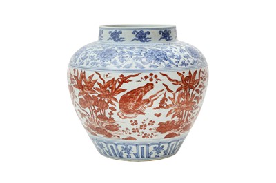 Lot 866 - A CHINESE COPPER RED-ENAMELLED BLUE AND WHITE 'LOTUS POND' JAR