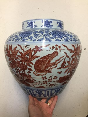 Lot 494 - A CHINESE COPPER RED-ENAMELLED BLUE AND WHITE 'LOTUS POND' JAR