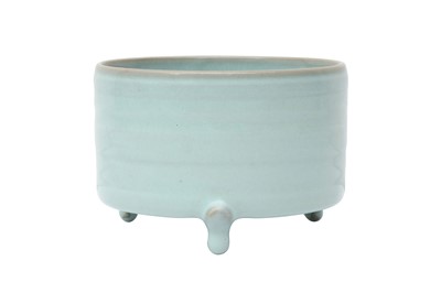 Lot 497 - A CHINESE CELADON-GLAZED TRIPOD CENSER