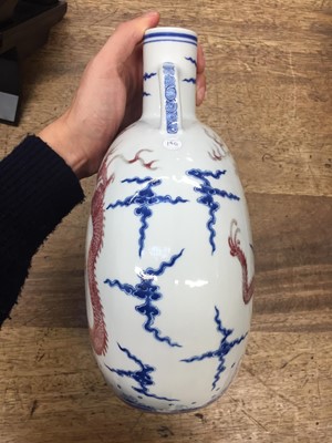 Lot 140 - A CHINESE BLUE AND WHITE AND COPPER-RED 'DRAGON' MOONFLASK, BIANHU