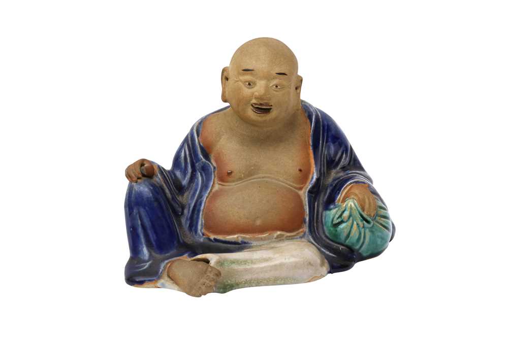 Lot 523 - A CHINESE FIGURE OF A RECLINING BUDAI