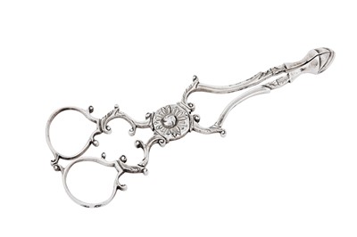 Lot 620 - A rare pair of George II Irish sterling silver tea tongs or sugar nips, Dublin circa 1750 by G.T attributed to Grey Townsend (active circa 1744-58)