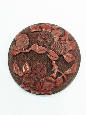Lot 67 - A CHINESE CINNABAR LACQUER 'LYCHEE' CIRCULAR SEAL PASTE BOX AND COVER