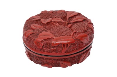 Lot 68 - A CHINESE CINNABAR LACQUER 'LYCHEE' CIRCULAR SEAL PASTE BOX AND COVER