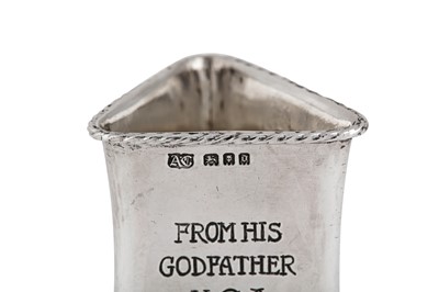 Lot 537 - A George V ‘Arts and Crafts’ sterling silver napkin ring, London 1919 by Alwyn Carr