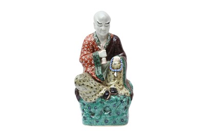 Lot 207 - A CHINESE FAMILLE-VERTE FIGURE OF A LUOHAN