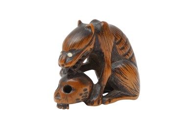 Lot 613 - A JAPANESE WOOD NETSUKE OF A WOLF