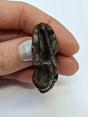 Lot 613 - A JAPANESE WOOD NETSUKE OF A WOLF