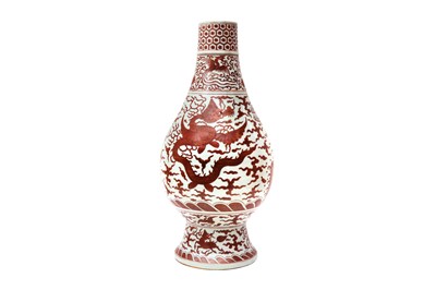 Lot 53 - A LARGE CHINESE IRON RED-DECORATED 'DRAGON AND PHOENIX' VASE