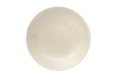Lot 14 - A CHINESE DING WARE 'DRAGON' BOWL