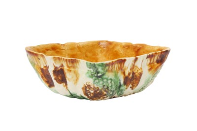 Lot 10 - A CHINESE SANCAI-GLAZED MOULDED POTTERY CUP