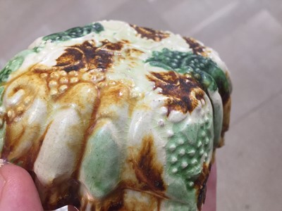 Lot 10 - A CHINESE SANCAI-GLAZED MOULDED POTTERY CUP