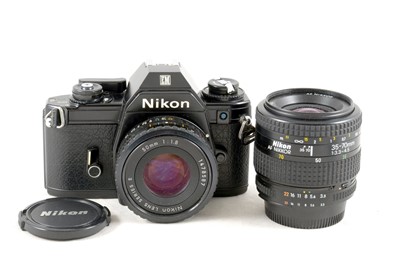 Lot 36 - A Nikon EM 35mm Film SLR with 2 Nikkor Lenses.