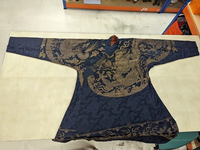 Lot 356 - A CHINESE BLUE-GROUND 'DRAGON' SILK ROBE