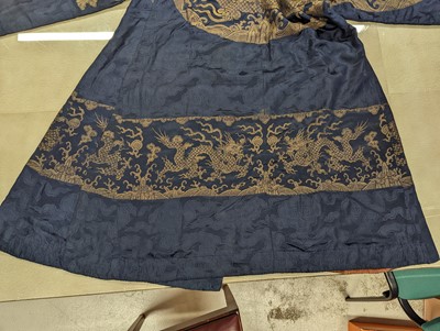 Lot 356 - A CHINESE BLUE-GROUND 'DRAGON' SILK ROBE