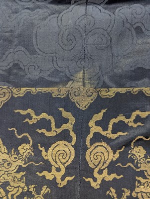 Lot 356 - A CHINESE BLUE-GROUND 'DRAGON' SILK ROBE