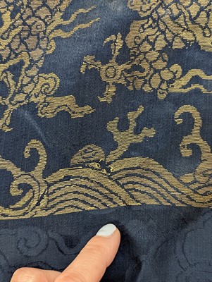 Lot 356 - A CHINESE BLUE-GROUND 'DRAGON' SILK ROBE