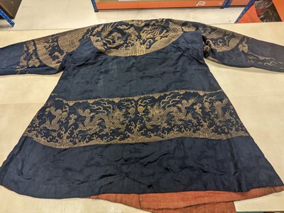 Lot 356 - A CHINESE BLUE-GROUND 'DRAGON' SILK ROBE