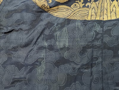 Lot 356 - A CHINESE BLUE-GROUND 'DRAGON' SILK ROBE