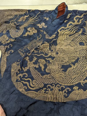 Lot 356 - A CHINESE BLUE-GROUND 'DRAGON' SILK ROBE