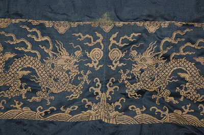 Lot 356 - A CHINESE BLUE-GROUND 'DRAGON' SILK ROBE