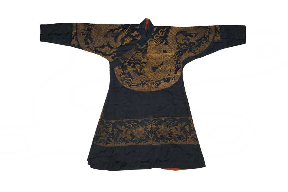 Lot 356 - A CHINESE BLUE-GROUND 'DRAGON' SILK ROBE