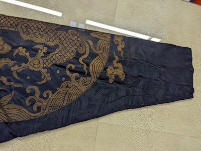 Lot 356 - A CHINESE BLUE-GROUND 'DRAGON' SILK ROBE