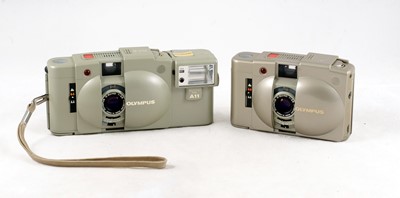 Lot 54 - A Pair of "Urban White" Olympus XA2 Compact Cameras.