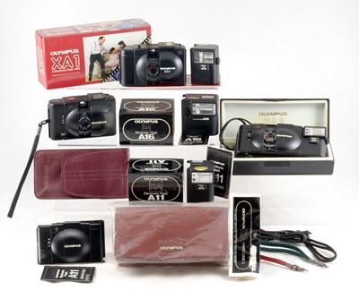 Lot 62 - An End Lot of Olympus XA Series Cameras & Accessories.