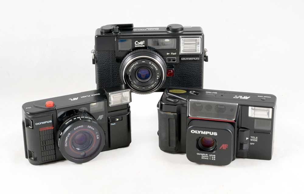 Lot 66 Three Olympus PointandShoot Compact Cameras.