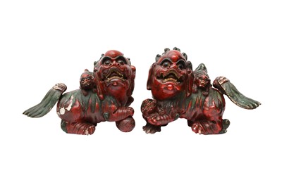 Lot 426 - TWO CHINESE LACQUER FIGURES OF LION DOGS