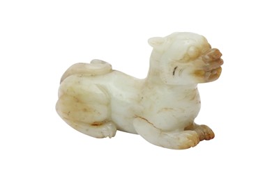 Lot 300 - A CHINESE PALE CELADON JADE CARVING OF A DOG