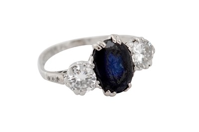 Lot 46 - A sapphire and diamond three-stone ring
