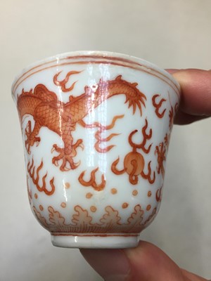 Lot 72 - A PAIR OF CHINESE IRON-RED 'DRAGON' CUPS