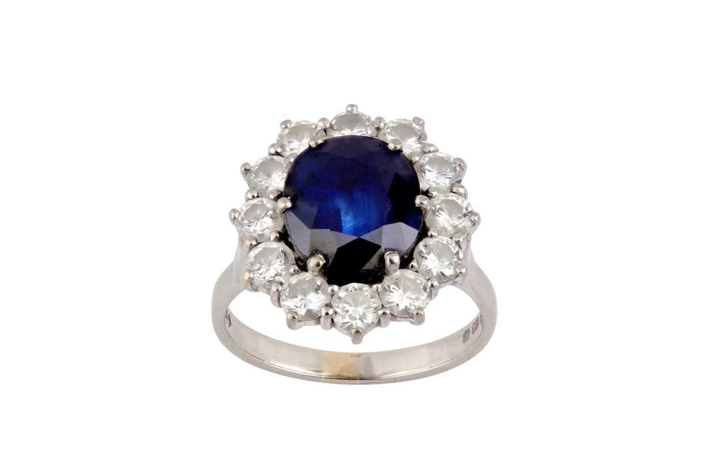 Lot 47 - A sapphire and diamond cluster ring, 1980
