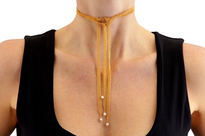 Lot 1 - Elsa Peretti for Tiffany & Co.| A gold and cultured pearl Mesh scarf necklace and earrings