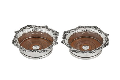 Lot 426 - A pair of George IV sterling silver wine coasters, Sheffield 1826 by John and Thomas Settle