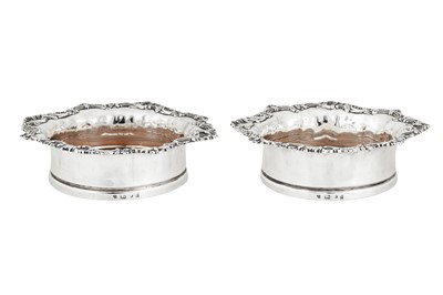 Lot 426 - A pair of George IV sterling silver wine coasters, Sheffield 1826 by John and Thomas Settle