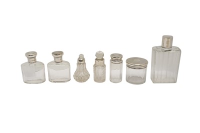 Lot 109 - A GROUP OF STERLING SILVER MOUNTED GLASS COLOGNE BOTTLES LONDON  1924 BY J.P&CO