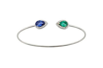 Lot 152 - An emerald, sapphire and diamond torc bangle