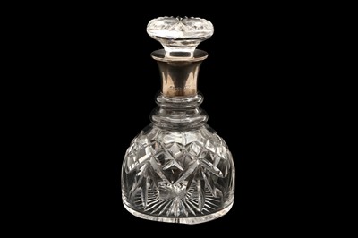 Lot 317 - A GEORGE V CUT GLASS SHIPS DECANTER WITH A STERLING SILVER COLLAR, BIRMINGHAM 1935, BY ASPREY