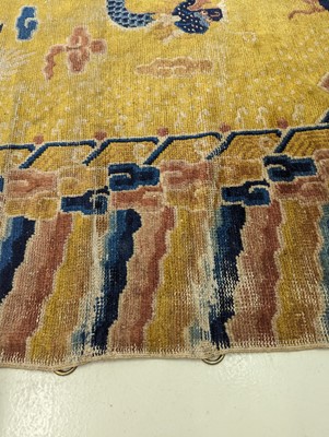 Lot 57 - A RARE CHINESE NINGXIA YELLOW-GROUND 'NINE DRAGON' CARPET