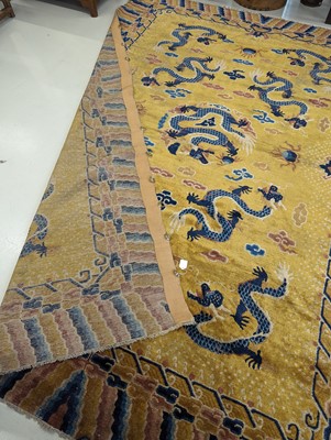 Lot 57 - A RARE CHINESE NINGXIA YELLOW-GROUND 'NINE DRAGON' CARPET