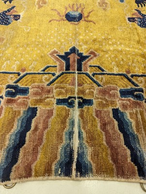 Lot 57 - A RARE CHINESE NINGXIA YELLOW-GROUND 'NINE DRAGON' CARPET