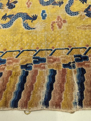 Lot 57 - A RARE CHINESE NINGXIA YELLOW-GROUND 'NINE DRAGON' CARPET